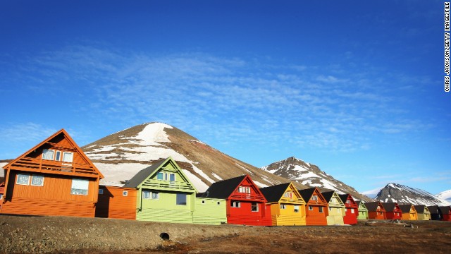 From April 20 to August 23, the sun never sets over Svalbard, a Norwegian archipelago that lies north of Greenland in the Arctic Sea. Here, colorful cabins reflect the midnight sun in June in Longyearbyen, the capital of Svalbard.