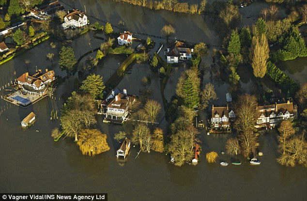 Swamped: Flooding on the River Thames last week. David Rose said the BBC followed an agenda