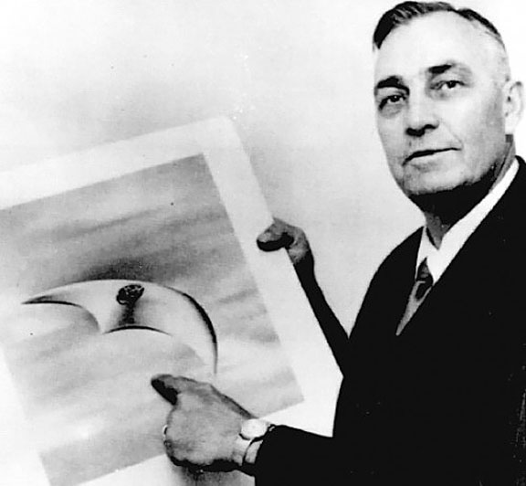 Pilot Kenneth Arnold with an illustration of a UFO he saw in 1947. The modern run of UFO sightings began when Arnold reported seeing nine objects flying in a V-formation over Mt. Ranier in Washington. Click for more on the story.