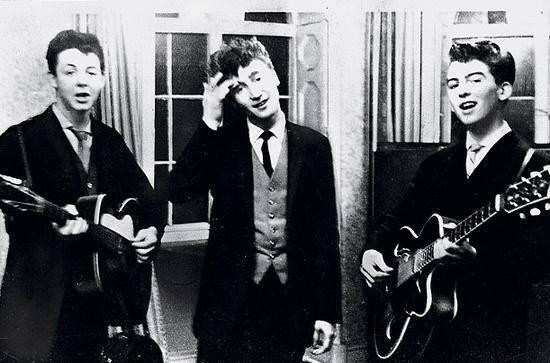 Paul McCartney, John Lennon & George Harrison performing at a wedding reception, 1958.